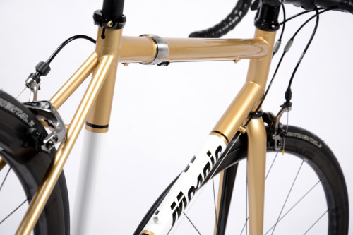 A Mosaic Steel TT-1 Travel bike in gold